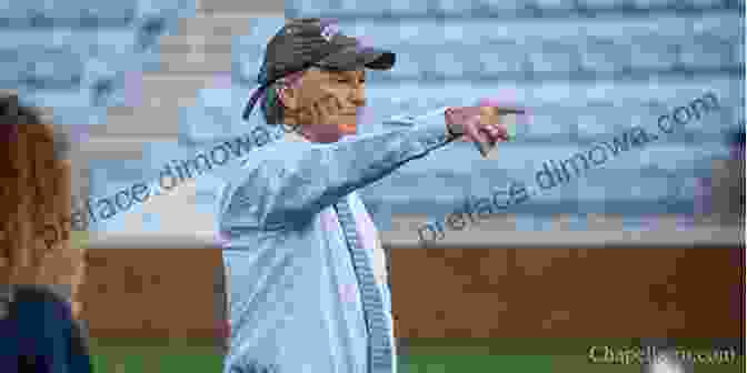 Anson Dorrance Coaching The University Of North Carolina Women's Soccer Team, Demonstrating A Play With His Arms Extended. The Man Watching: Anson Dorrance And The University Of North Carolina Women S Soccer Dynasty